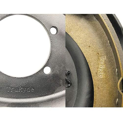 TruRyde self-adjusting electric brake assembly for trailer axles, front view showing backing plate and gold brake shoe