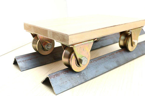 V Groove Rigid Track Wheel For Sliding Gates And Barn Doors on metal rail, heavy duty casters, double bearings visible