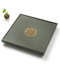 Top Shelf Green Slate Tea Tray With Integrated Drainage For Snazzy Kung Fu Ceremonies And Cool Home Office Vibes Stylish Square Serving Board in dark green with decorative draining hole.