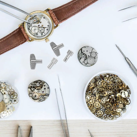 Clock Winding Key For Mechanical Clocks, Pro Repair Tool, metal parts and gears for vintage alarm clocks on workbench
