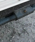 Close-up of 10 Inch Weld On Straight Greaseable Ramp Door Hinge For Trailers With Grease Fitting Weld On Design Raw Steel Finish installed