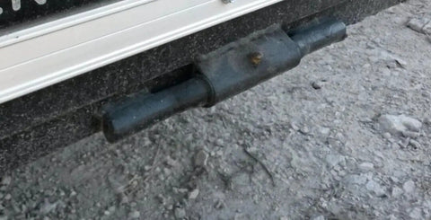 Close-up of 10 Inch Weld On Straight Greaseable Ramp Door Hinge For Trailers With Grease Fitting Weld On Design Raw Steel Finish installed