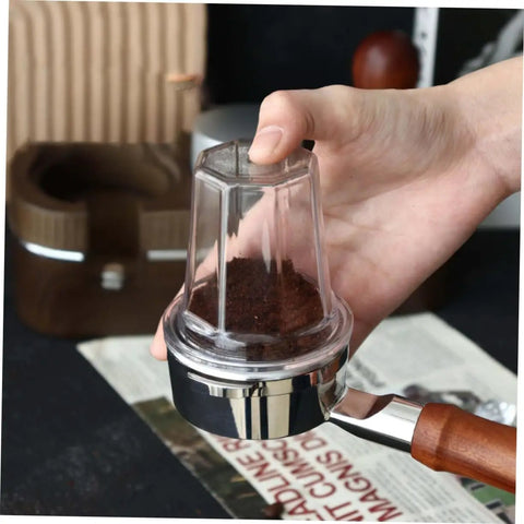 Espresso Dosing Cup For Coffee Machines With Anti Scatter Powder Design, clear plastic cup in hand over portafilter