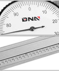 Close-up of Pro Grade Stainless Steel Dial Caliper 6 Inch Measuring Micrometer with Lockable Head, showing dial and scale.