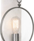 One Light Wall Sconce With Dark Antique Nickel Finish And Clear Seeded Glass rock solid construction showcases a round seeded glass shade.
