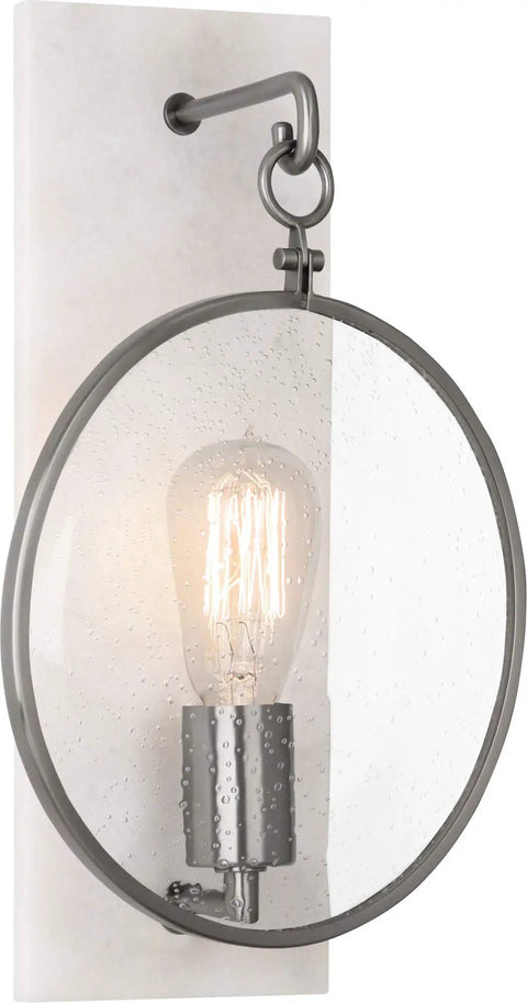 One Light Wall Sconce With Dark Antique Nickel Finish And Clear Seeded Glass rock solid construction showcases a round seeded glass shade.