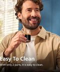 A man enjoying espresso from a glass, showcasing the Fully Automatic Espresso Machine Crushing Your Morning Cravings With One Touch Brewing And Classic Milk Frother For Silky Cappuccinos Featuring Precision Ceramic Grinder And Sleek Black Touch Display.