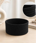 Super Handy Small Woven Cotton Rope Basket For Versatile Home Organization Black Storage Bin atop a wooden surface.