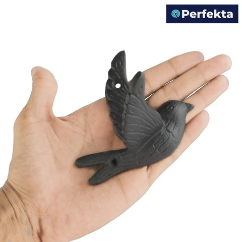 Straight Up Solid Cast Iron Flying Bird Wall Hooks Set Of 5 Rustic Farmhouse Coat Pegs For Entryway Bathroom Bedroom To Snag Keys Towels Hats And Bags With Screws in a hand