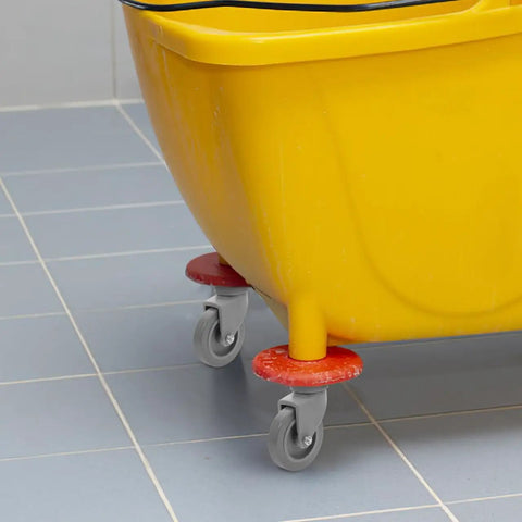 4 Piece Heavy Duty Rubber Swivel Caster Wheels With Threaded Stem And Spring Loaded Setup For Slick Rolling On Mop Buckets Trash Dolly Furniture Carts Grey attached to yellow mop bucket.