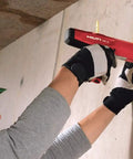 Worker using a powder actuated fastener cartridge tool for concrete and steel, .27 caliber, short 6.8/11 mm, yellow medium duty.