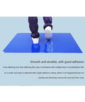 Person stepping on Heavy Duty Peel And Stick Sticky Floor Mats For Cleanrooms Warehouses And Homes Hardcore Adhesive Dirt Trap Liner.