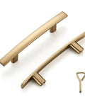 Two champagne bronze curved bar cabinet handles with 3 inch hole centers, part of the 10 Pack Solid 3 Inch Hole Center Curved Bar Cabinet Handles Five And Three Sixteenths Inches Long Black Matte Finish Kitchen Pulls For Cabinets Dressers Cupboards Zinc Alloy Construction Tough As Nails set.