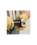 Person using Go To Deburring Tool For Plastic Pipes 1 1/4 To 4 Inches, Quick 3/32 Inch 15 Degree Chamfer on black pipe