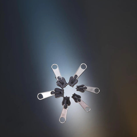 Six Black Universal Zipper Repair Kit Sliders Instant Fix for Jackets Bags and Pants displayed in a circle on a dark background.