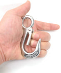 Hand holding 304 Stainless Steel Grab And Slip Hook Rigging Accessory With Spring Loaded Latch, Heavy Duty Lifting Hook Rated Up To 440 Lbs 200 Kg