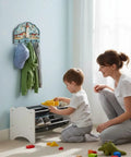 Child and parent organizing shoes under a wall mounted key holder with four hooks, rustic wood key rack with home decoration.