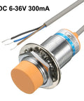 Capacitance Proximity Sensor Switch NPN NO DC 6-36V 300mA with wires visible, showing metal thread and orange cap