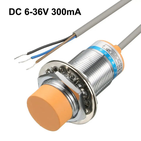 Capacitance Proximity Sensor Switch NPN NO DC 6-36V 300mA with wires visible, showing metal thread and orange cap