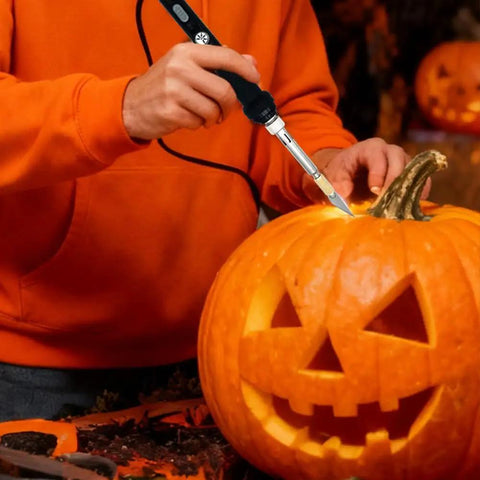 Afantti 31 Piece Electric Hot Knife Foam Cutter Kit with 23 Plastic Cutting Blades used to carve a pumpkin.
