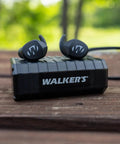 Silencer Bluetooth In-Ear Ear Buds 2.0 for Hearing Protection, rechargeable, on wooden table, with 24 dB NRR, outdoor background