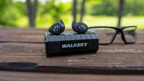 Silencer Bluetooth In-Ear Ear Buds 2.0 for Hearing Protection, rechargeable, on wooden table, with 24 dB NRR, outdoor background