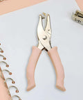 Two Size Hole Punch Set With One Quarter Inch And One Eighth Inch Holes, 2 Pack Craft Punchers With Soft Silicone Grip Handles displayed on paper