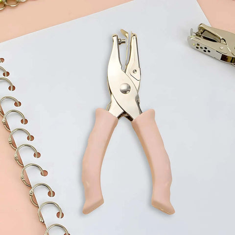 Two Size Hole Punch Set With One Quarter Inch And One Eighth Inch Holes, 2 Pack Craft Punchers With Soft Silicone Grip Handles displayed on paper