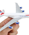 Hand holding British Airways A380 Diecast Model Plane White Dope Collectible For Aviation Fans Realistic Details Great Display Piece