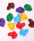 Colorful resin holds from the 18 Piece Tree Climbing Holds Set With Six Ten Foot Ratchet Straps For Outdoor Tree Climbing Kit Ideal For Backyard Gyms Obstacle Courses And Nature Play