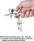 Hand holding airbrush with Inline Airbrush Filter With Five Micron Water Moisture Trap And Oil Separator With One Eighth Inch Threads