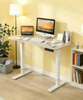 Home Office Game Changer Electric Standing Desk With Height Adjustable Programmable Memory Buttons Solid Steel Frame Smooth Motor Lift For Daily Comfort And Reliable Performance In 48 By 24 Inches with a laptop and monitor.