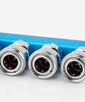 Close-up of Two Pack 3 Way One Half Inch Air Manifold Block Splitter Inline Fittings For Air Hose And Pneumatic Compressor System Durable Iron Silver Blue Finish Multi Port Splitter For Quick Air Distribution Easy Install Built Tough For Busy Shops