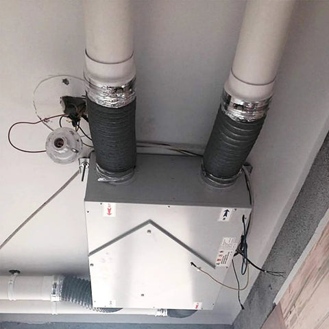 HVAC system with Heavy Duty Aluminum Foil Tape For HVAC Sealing And Patching High Temperature Silver Duct Tape on joints.