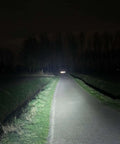 Beam of LH8 Weapon Light Head 6500K 1750 Lumen 77000 Candela illuminating a path at night for rugged outdoor use