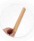 Hand holding a solid wood cabinet handle from the Solid Wood Cabinet Handles Set Of 2 For Drawers Wardrobe Doors And Kitchen Cupboards Built To Last Furniture Hardware With 192mm Center To Center Easy To Install Classic Rustic Farmhouse Style.