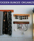 Wooden bungee organizer for hanging cords, sunglasses, and scarves in living space. Accessories not included.