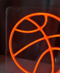 Close-up of Basketball Neon Sign LED Light 11.8 Inch for Bedroom Decor and Game Room Aesthetic, glowing orange detail.