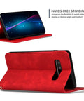 Red smartphone case with hands-free standing feature, showing front and back view of phone propped up for display.