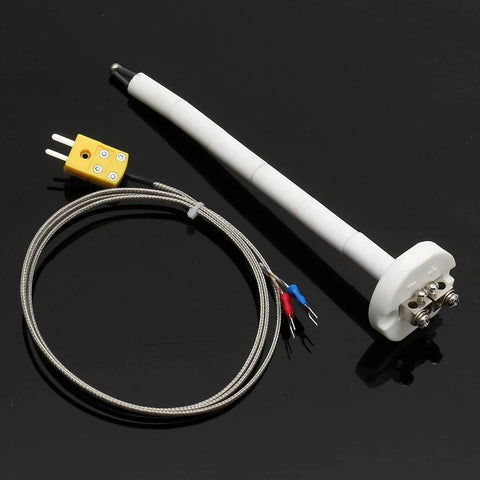 K thermocouple kiln probe with white ceramic insulator tube, braided stainless lead, and yellow terminal block