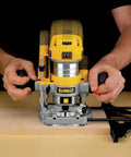 Using Powerful 1.25 HP Variable Speed Router Kit With Fixed And Plunge Bases on hardwood surface for precise woodworking