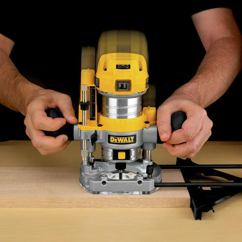 Using Powerful 1.25 HP Variable Speed Router Kit With Fixed And Plunge Bases on hardwood surface for precise woodworking