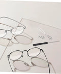 Eyeglass Repair Kit With Precision Screwdriver Set Sunglass Screws Replacement Nose Pad Cushions Tweezers And Storage Case For Quick Eyewear Fixes While Traveling featuring two pairs of eyeglasses with repair tools.