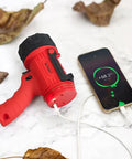 Rechargeable Handheld Spotlight Flashlight 200000 Lumens, Waterproof IP67 Hunting Lamp charging a phone outdoors on leaves