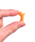 Close-up of hand holding orange earplug from Corded Sleep Ear Plugs Set With Flexible Cord, 20 Pairs Reusable Silicone.