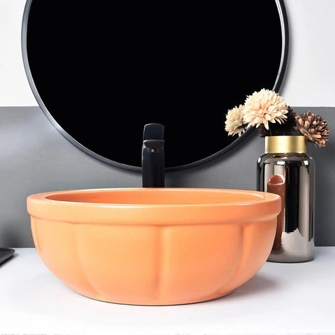 Round Sink Bowls For Bathroom Vessel Sink, 15.7 Inch Ceramic Vessel Sink with orange finish and faucet on countertop.