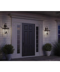 Burlington Three Light Large Wall Lantern With Clear Beveled Glass In Polished Nickel And Antique Bronze Finish illuminating entryway