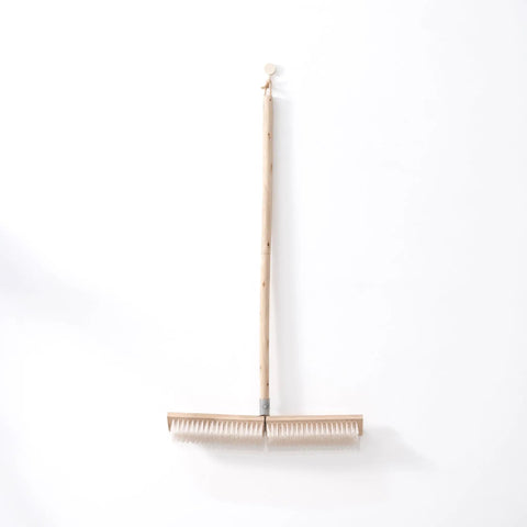 Heavy Duty Push Broom With Rock Solid Four Layer Stiff Plastic Bristles And A Beefy Wooden Handle, 82 cm long for outdoor cleanup.