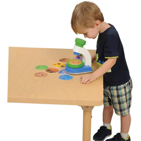 Kid Friendly Microscope Kit With 3 Interchangeable Lenses Magnified Tinted And Kaleidoscope Includes 10 Nature Slides Colorful Design And Fun STEM Learning For Ages 2 And Up, child using microscope on table
