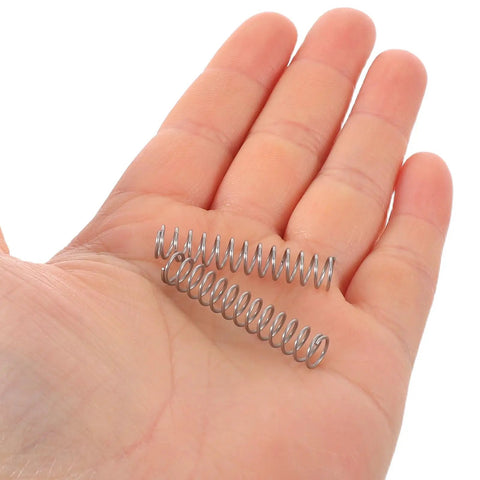 Grab These 10 Pack Stainless Steel Sprayer Compression Springs For Garden Pump Bottle Repair And Rebuild. Easy Swap Universal Replacement Ensures Quick Fixes And Smooth Operation Without Any Fuss Or Hassle For Your Diy Projects. stainless steel springs in hand